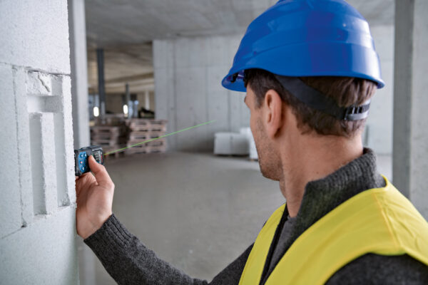 High-visibility green laser beam active on a Bosch GLM 50-27 CG professional measure.