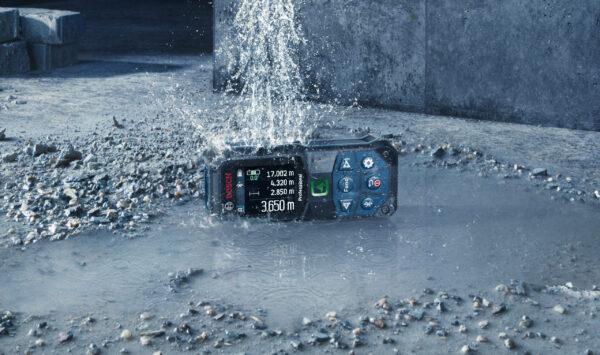 Bosch 50m laser measure showing IP65 water and dust protection in wet site conditions.